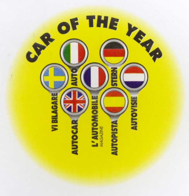 Az embléma szelepeket mintáz. A szeleptányéron látható az ország zászlaja, a szelep szárán a lap neve