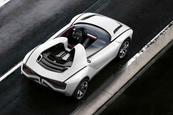 Elegáns, agresszív terepkupé Giugiarótól 1 A roadster a merevítő tető hiányát szénszálas erősítésű bukókerettel ellensúlyozza. A V10-es motor a dizájn fontos eleme