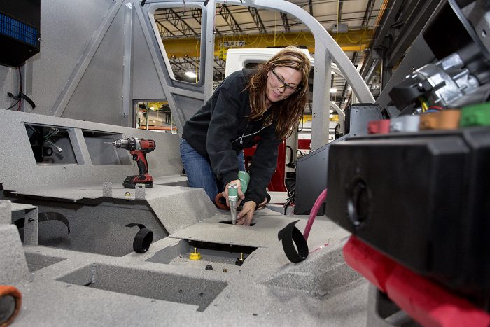Tracy Munden, assembling cab of vehicle in  Neenah, Wisconsin, U