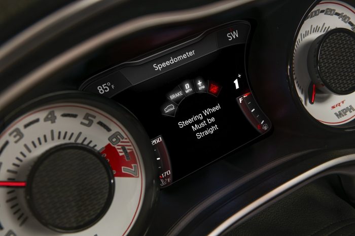 Száz fotón, két videón a világ leggyorsabb utcai autója 59 The TransBrake set-up screen on the 2018 Dodge Challenger SRT Demon’s 7-inch instrument cluster screen centered between the exclusive SRT Demon white face gauges.