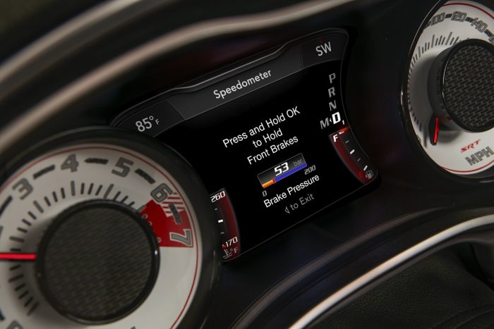 Száz fotón, két videón a világ leggyorsabb utcai autója 61 The line lock brake pressure gauge on the 2018 Dodge Challenger SRT Demon’s 7-inch instrument cluster screen is centered between the exclusive SRT Demon white face gauges.