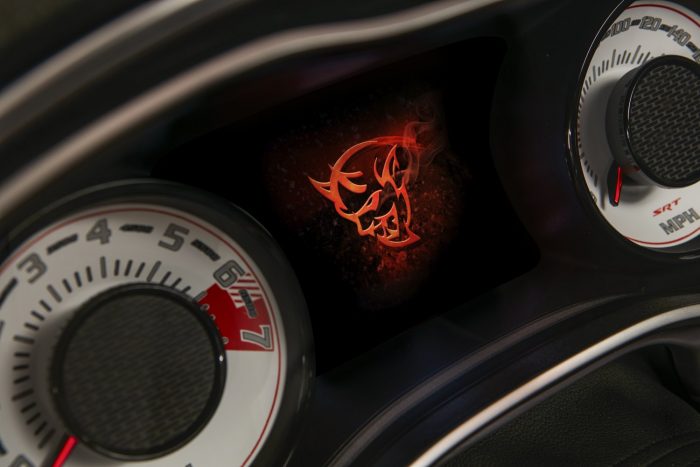 Száz fotón, két videón a világ leggyorsabb utcai autója 62 The Demon logo startup screen displayed on the 2018 Dodge Challenger SRT Demon’s 7-inch instrument cluster screen centered between the exclusive SRT Demon white face gauges.
