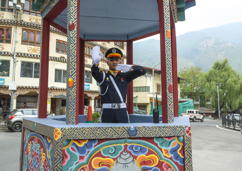 A traffic policeman at a circle road Chang Gewog Thimphu Bhutan | Vezess | Vezess